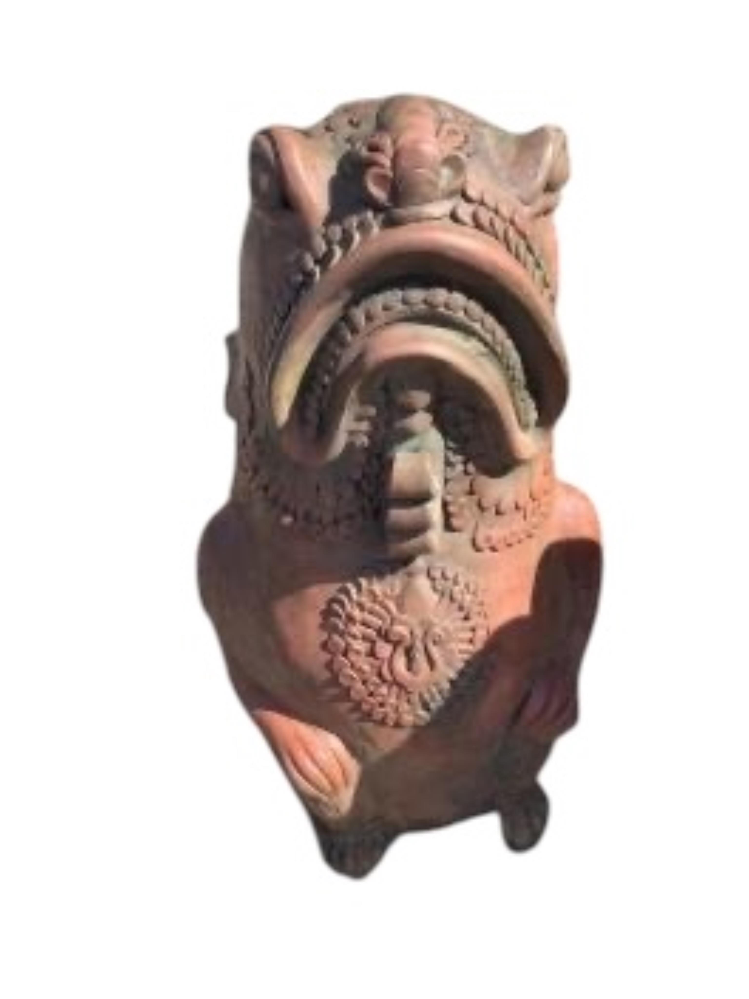 A pair of cast terracotta Oriental fish garden ornaments, height 61cm